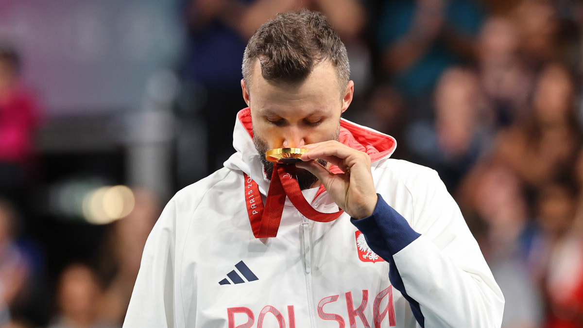 Poland's Patryk Chojnowski enjoys his Paralympic gold medal in the men's MS10 category. GETTY IMAGES