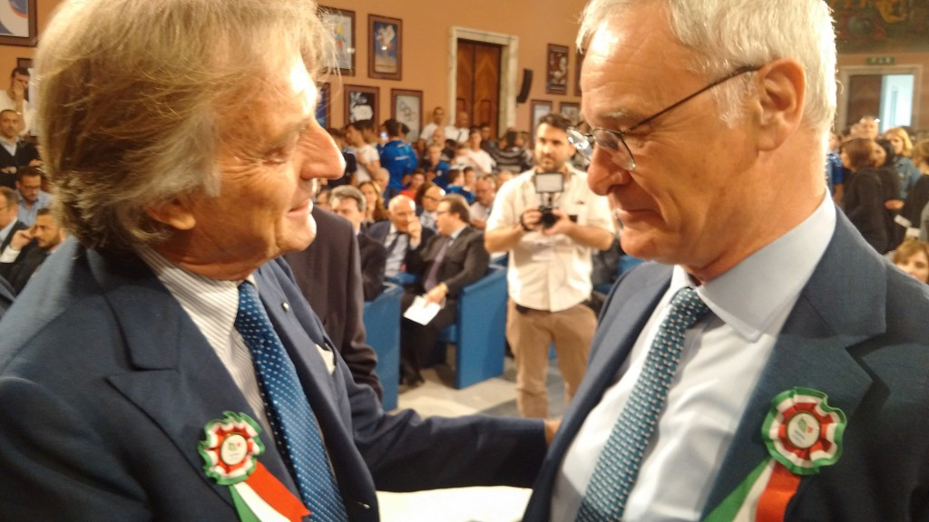 Claudio Ranieri (right) meets with Rome 2024 President Luca di Montezemolo while wearing a rosette featuring the bid logo
