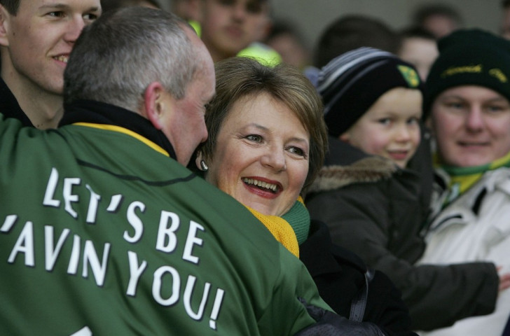 Delia Smith is embraced by a Norwich City fan who clearly took her 2005 outburst to supporters in a positive spirit ©Getty Images