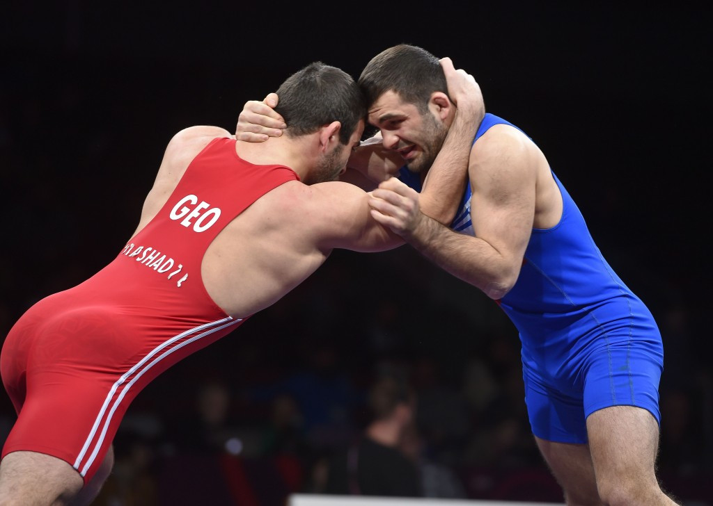 Poland’s Magomedmurad Gadzhiev (right) has lost his Olympic licence in the men's freestyle 65kg category