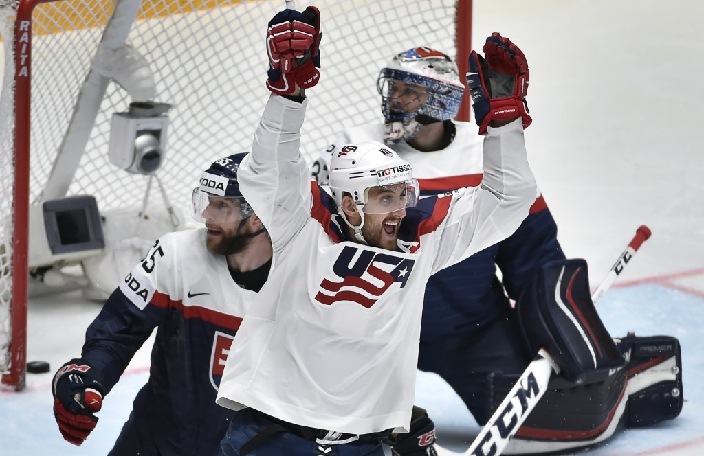United States reach IIHF World Championship quarter-finals despite overtime loss as Finland shock Canada