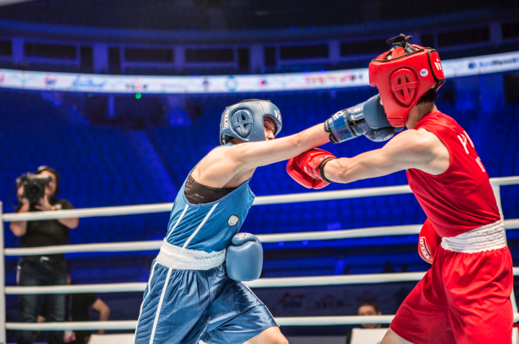 Kazakhshtan's Nazym Kyzaibay (blue) beat North Korea's Young Gum U to move within one win of defending her light flyweight title ©AIBA 