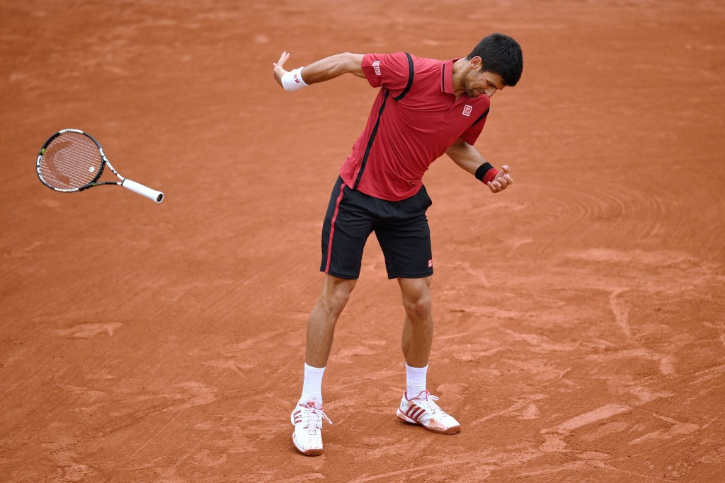 Djokovic was relieved to receive just a code violation after letting his racquet slip out of his hand while angrily swiping at the ground, narrowly missing a line judge ©Getty Images 