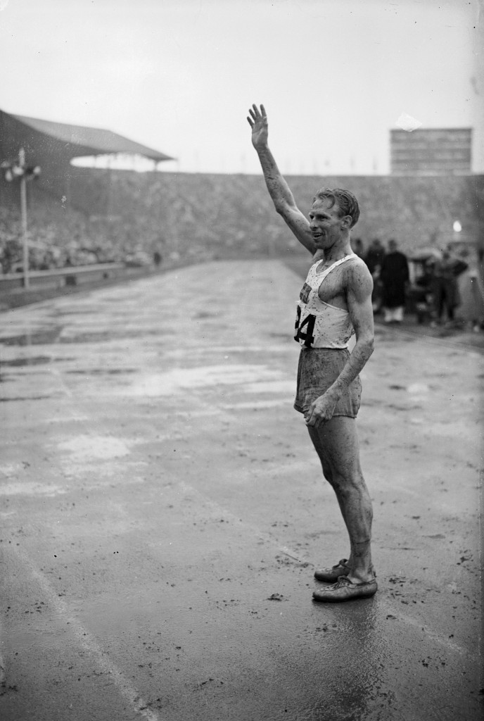 Henry Eriksson, Sweden’s 1,500m gold medallist at the 1948 London Games,  helped carry the flame