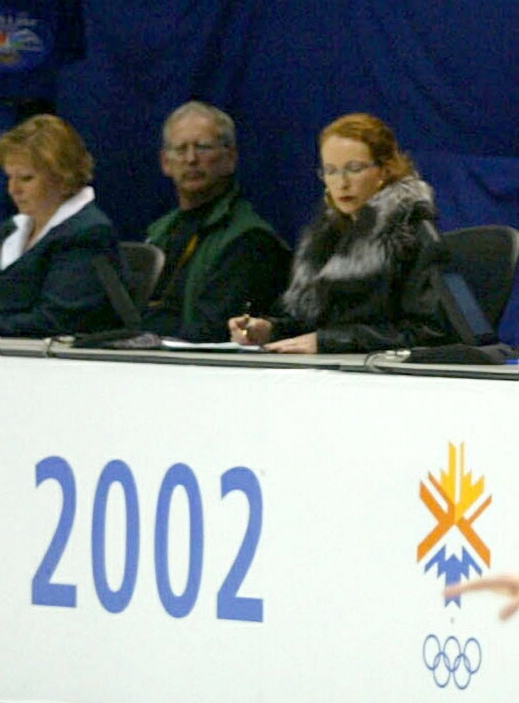 French judge Marie-Reine Le Gougne (right) consults her notes during the ice skating pairs final at the 2002 Salt Lake Games. She was later suspended for misconduct  ©Getty Images