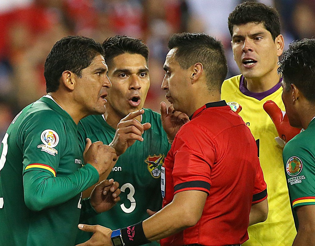 Bolivia were denied a first point after a controversial late penalty saw them lose 2-1 to Chile