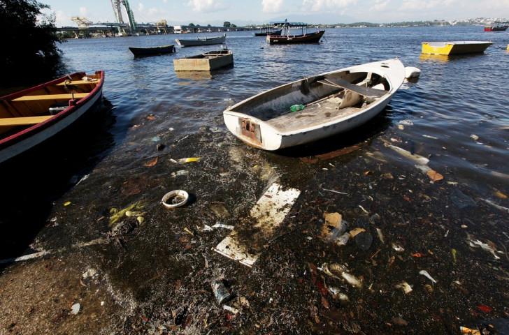 Protesters slam wasted "one billion dollars" to tackle pollution on Guanabara Bay in Rio de Janeiro