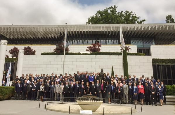 Members of both bid teams pictured with the IOC outside the Olympic Museum after the Briefing ©IOC