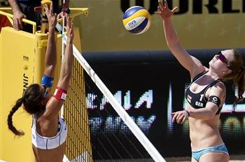 Julia Sude hits a smash during the victory over Poland ©FIVB