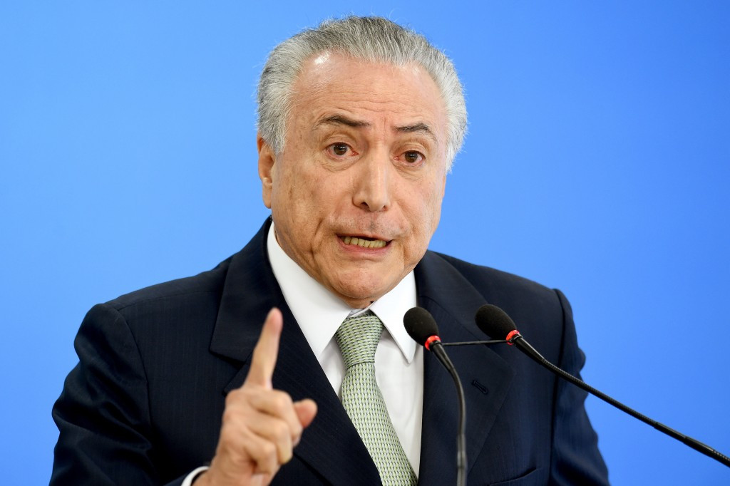 Interim President Michel Temer has denied using money to help fund an ally's election campaign