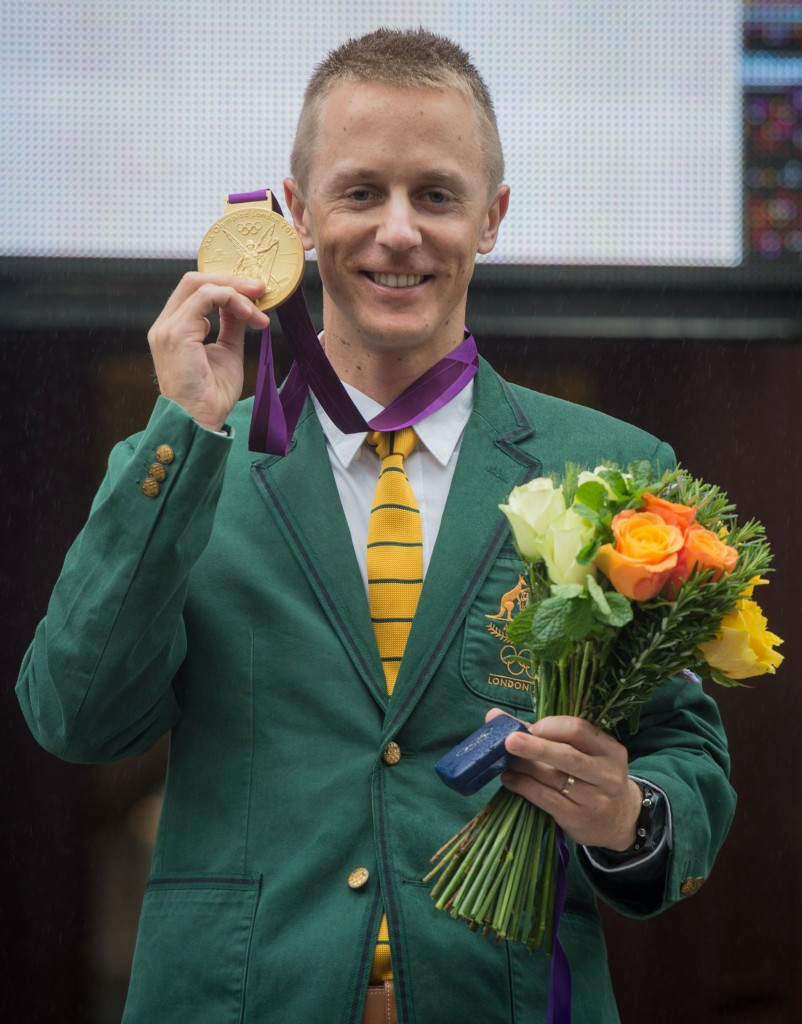 Jared Tallent with the Olympic gold medal for the London 2012 50km walk which he received at a public ceremony in Melbourne on Friday ©Getty Images