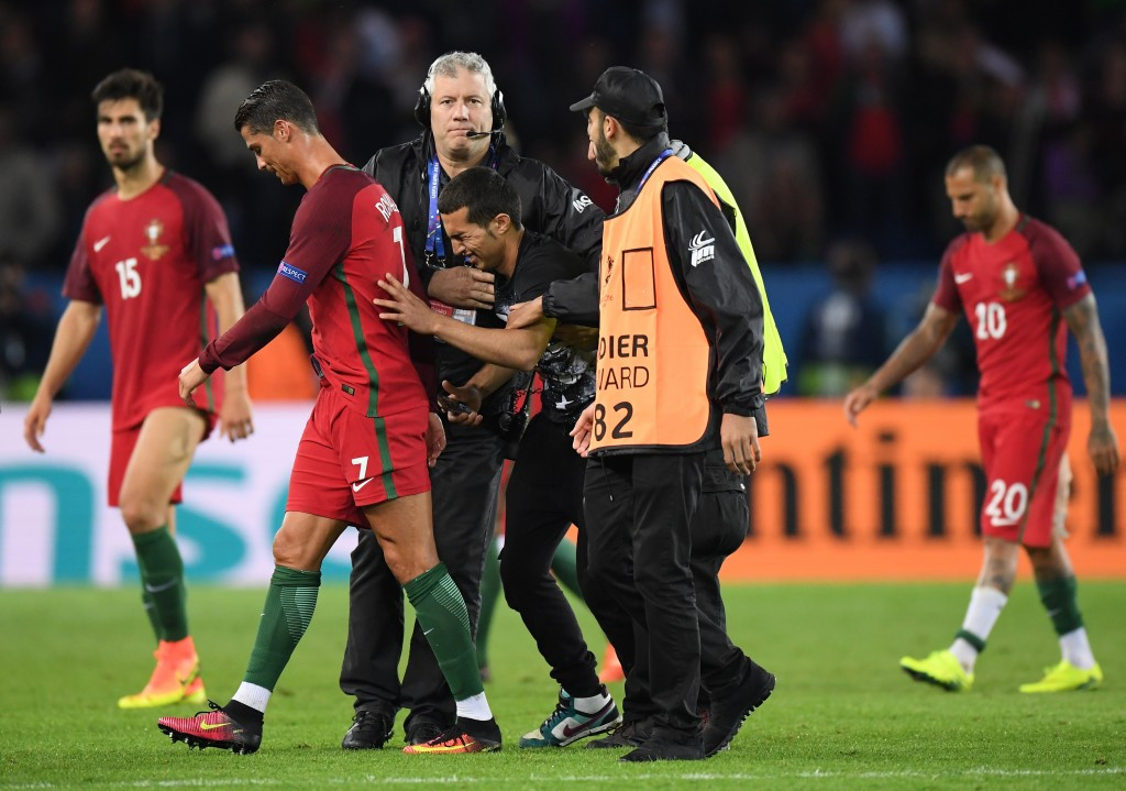 Portugal have been charged after one of their fans invaded the pitch to have a photo with their captain Cristiano Ronaldo