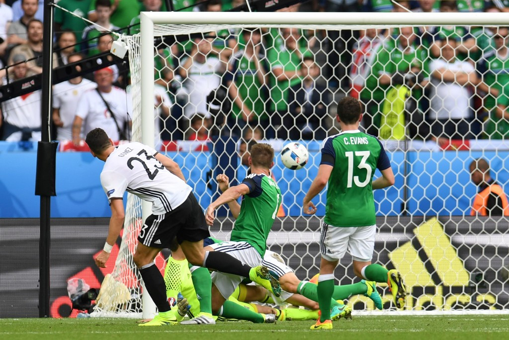 Mario Gomez scored as Germany topped their group, while Northern Ireland advanced as a best third place team