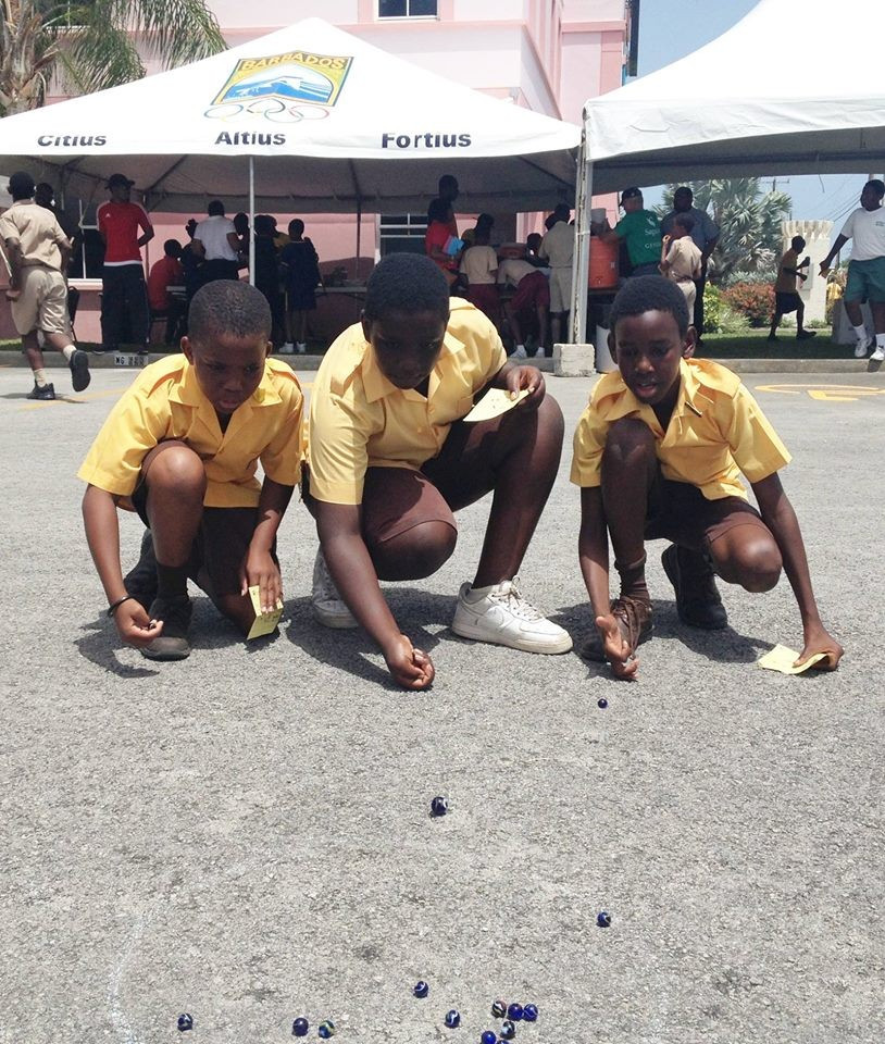 Youngsters in Barbados enjoyed playing marbles on Olympic Day ©BOA