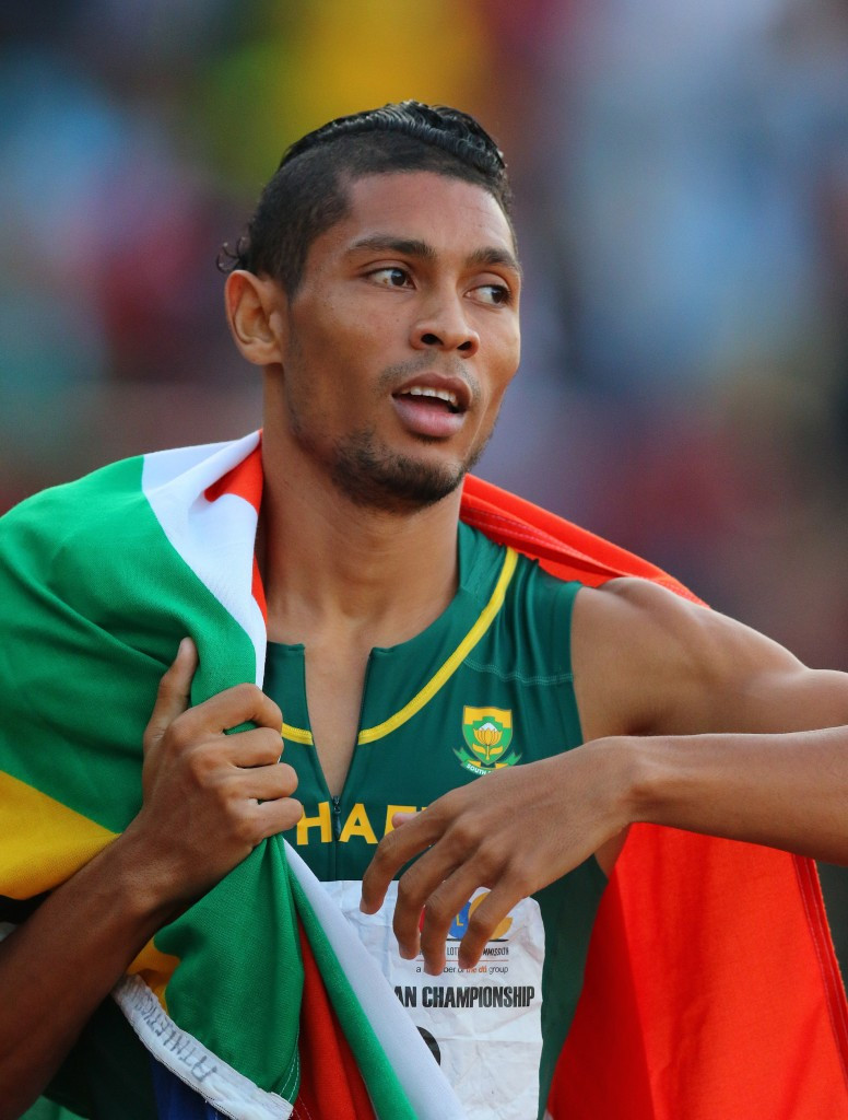 South Africa's world 400m champion Wayde van Niekerk flies the flag after winning the 200m at the African Championships in Durban ©Getty Images