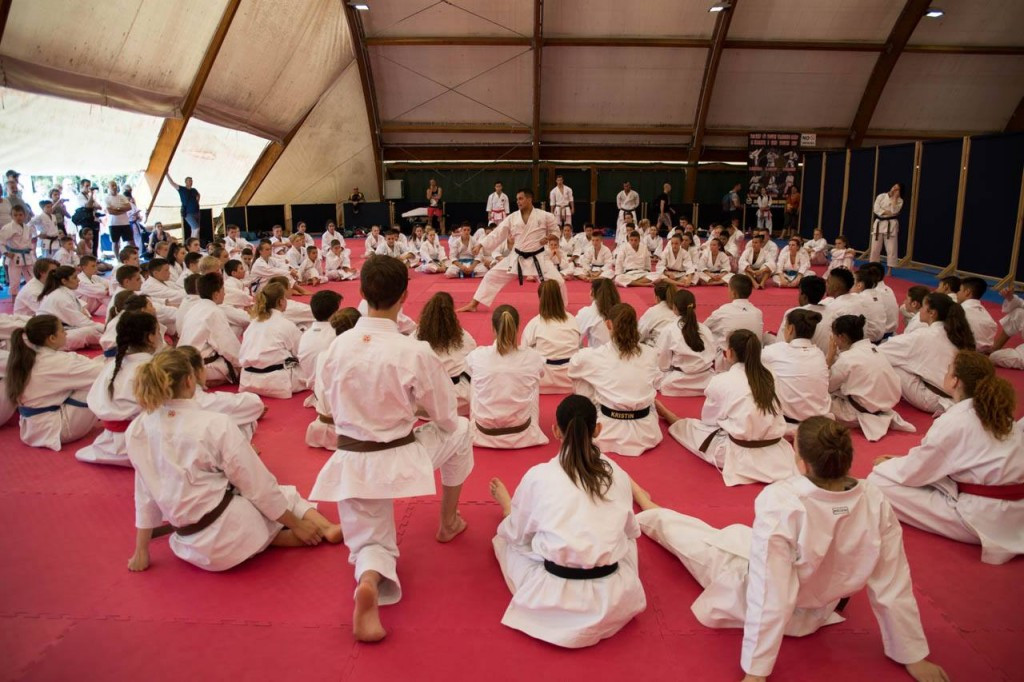 Coaches demonstrating karate moves to the youngsters during the opening day of the camp ©WKF/Facebook
