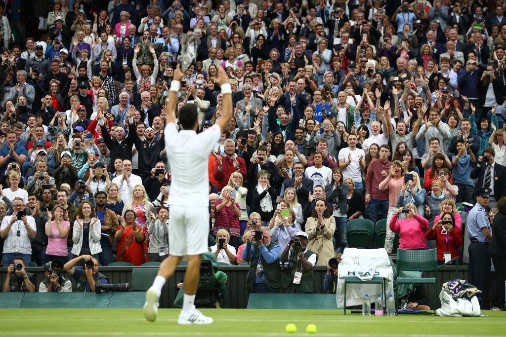 A Centre Court crowd cheers world number one Novak Djokovic following his victory ©Getty Images