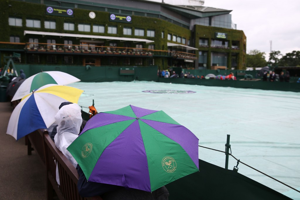 Wimbledon umbrellas were a familiar sight on the outer courts ©Getty Images