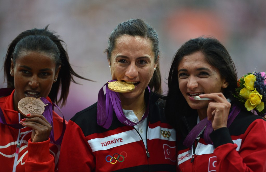 Turkey's Aslı Çakır Alptekin celebrating the Olympic gold medal she won at London 2012 but has subsequently been stripped of because of doping allegations ©Getty Images