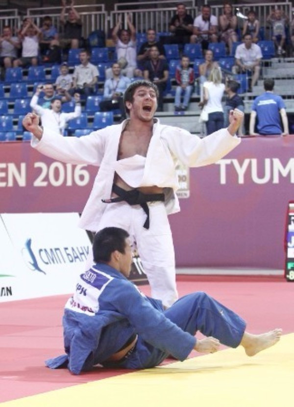 Asian Loppinagov celebrates a home win over Japan in the under 81kg event ©IJF