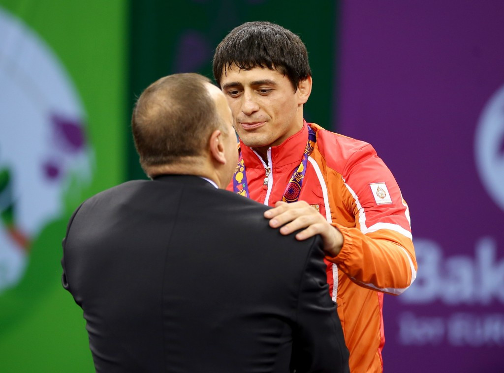 Wrestler Rasul Chunayev, Azerbaijan's first gold medal winner, was presented his medal by President Ilham Aliyev