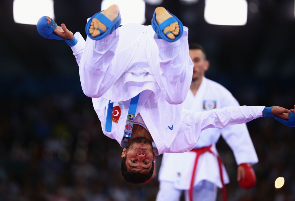 Turkey's Buruk Uygur celebrated winning his Kumite under 67 kilogram match in extravagant style