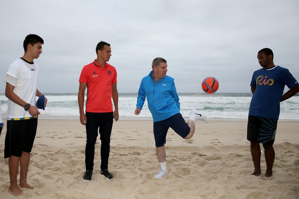 Thomas Bach also found time to play football on the beach ©Getty Images