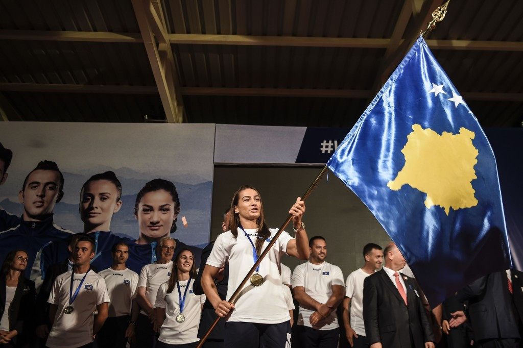 Kosovo judoka and gold medal hope Majlinda Kelmendi practices her flagwaving duties with one week to go ©Getty Images
