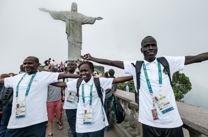 Yiech Pur Biel (right), Rose Nathike Lokonyen and their coach Joseph Domongole get the feel of Rio after arriving as part of the Refugee Olympic Team ©Getty Images