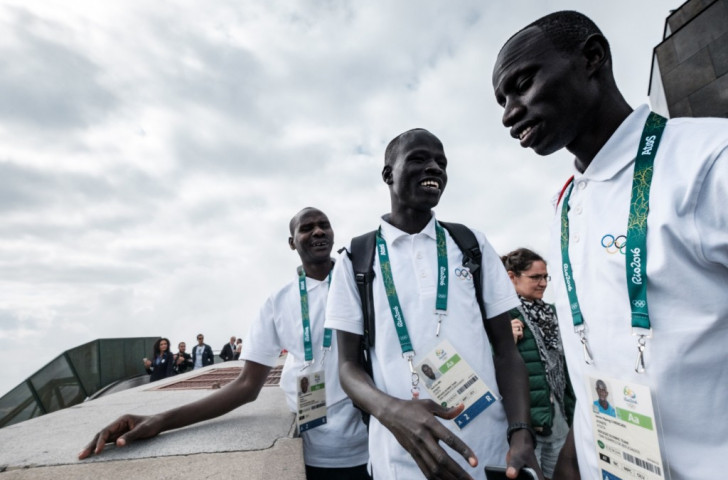 Refugee Olympic Team runners Yiech Pur Biel (centre) and James Chiengjiek (right) along with their Kenyan coach Joseph Domongole (left) get the feel of Rio, where they will compete on the track. ©Getty Images