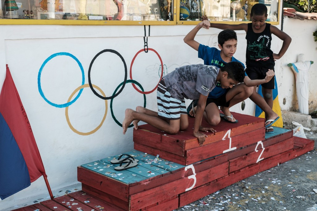 Local children enjoy a replica medals podium in Rio de Janeiro ©Getty Images