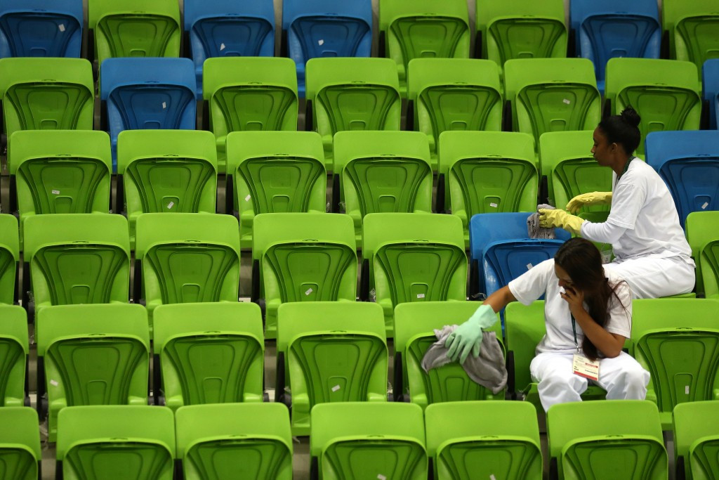 Workers clean seats inside one of the Rio 2016 Youth Arena ©Getty Images
