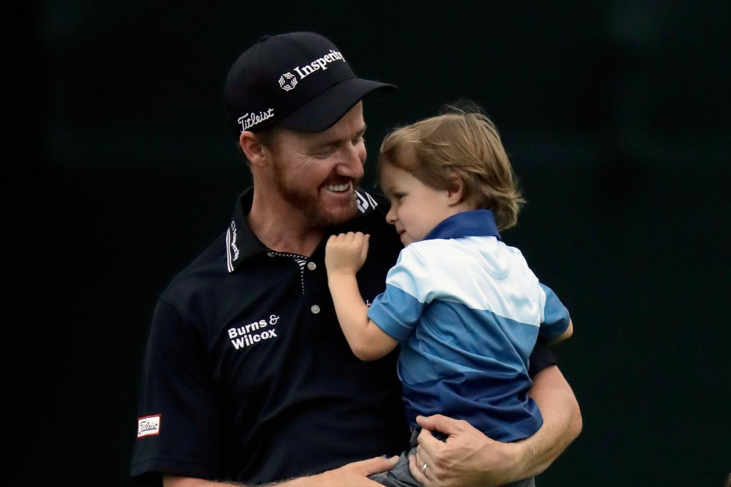 Jimmy Walker celebrates with his son following his victory ©Getty Images