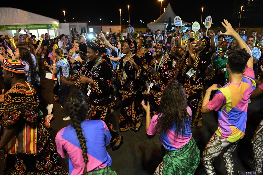 Cameroon's team are welcomed into the Athletes' Village ©Getty Images