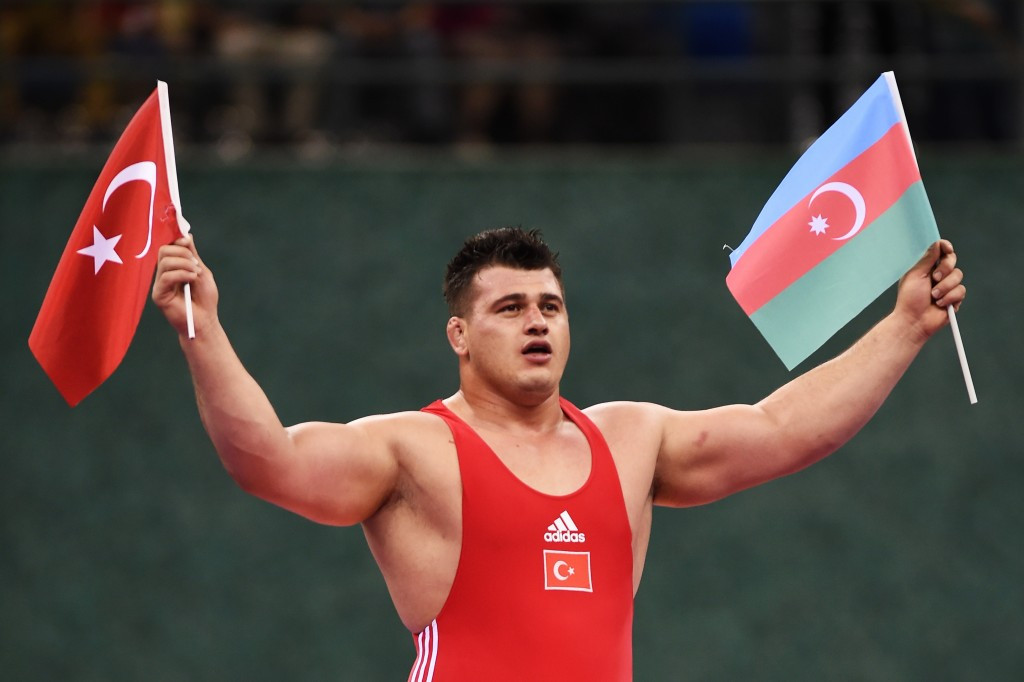 Riza Kayaalp clinched gold for Turkey but earned the acclaim of the crowd by holding both a Turkish and Azeri flag in celebration