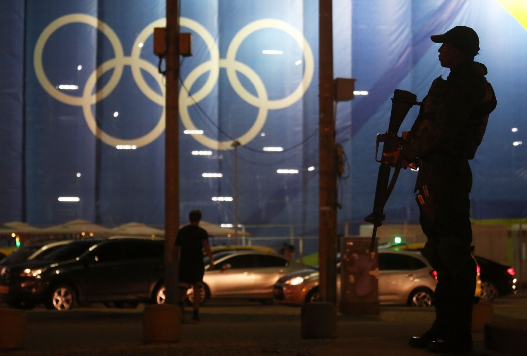 A soldier keeping watch outside the beach volleyball stadium in Copacabana