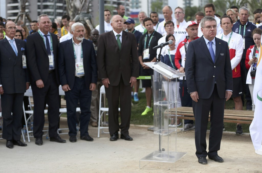 Thomas Bach attending a mourning place inauguration ceremony in the Athletes' Village ©Getty Images