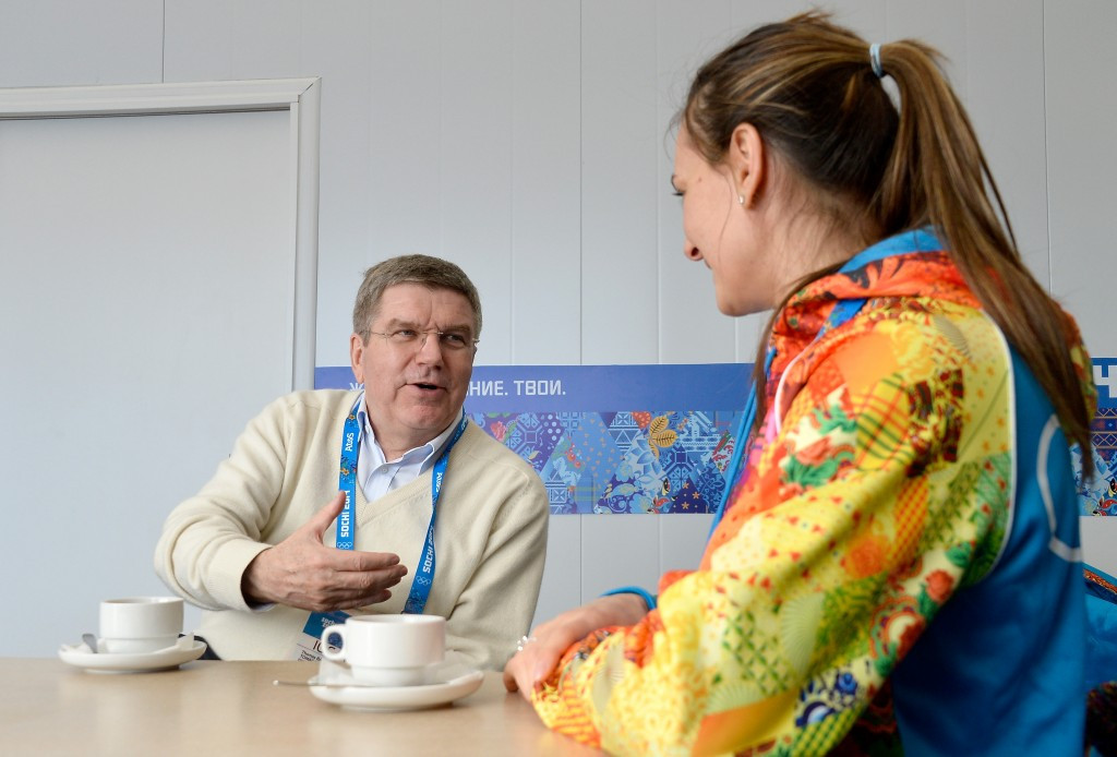 IOC President Thomas Bach pictured with Yelena Isinbayeva during Sochi 2014, where she was the Mayor of the Olympic Villae, despite being criticised for defending Russia's controversial anti-gay law ©Getty Images