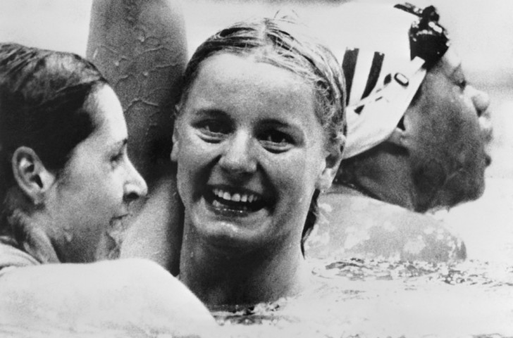 Kornelia Ender of East Germany celebrates victory in the 200m freestyle at the 1976 Montreal Olympics ahead of Shirley Babashoff (left) ©Getty Images