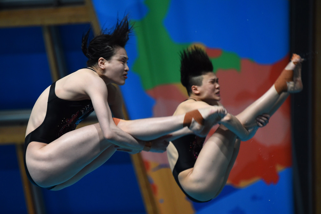 Wu Minxia, right, pictured at last year's world championships, will seek a fourth consecutive Olympic synchronised 3m springboard title at Rio 2016 ©Getty Images