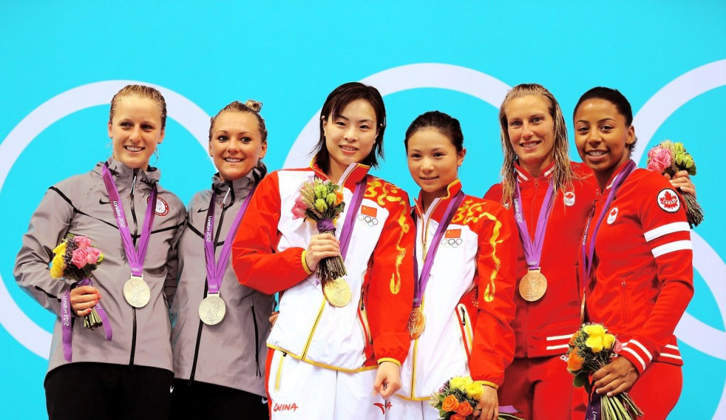 Wu Minxia, centre left, celebrates her gold medal in the synchronised 3m springboard at London 2012 with partner He Zi, centre right, who she will also compete with at Rio 2016 ©Getty Images