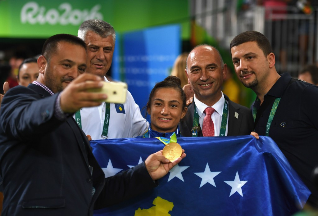 Majlinda Kelmendi celebrates her historic gold medal with supporters, including second right, Kosovan Olympic Committee President Besim Hasani ©Getty Images