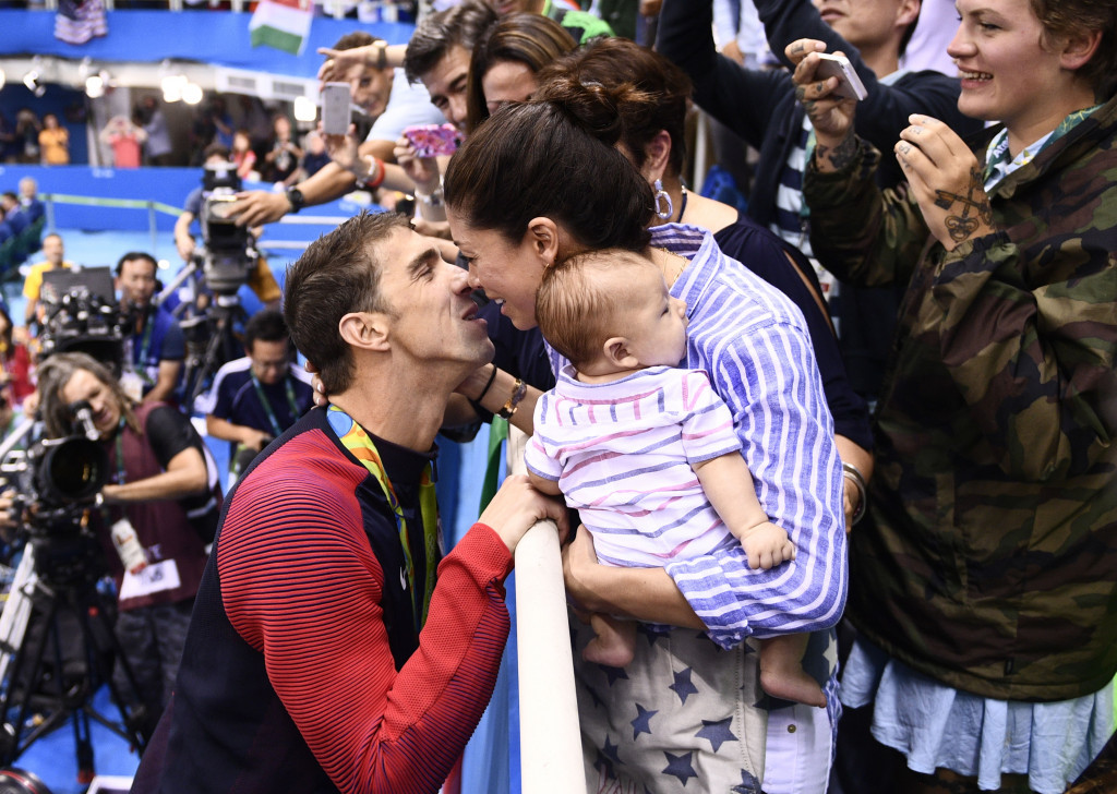 Michael Phelps celebrates with his family after winning the 200m butterfly title ©Getty Images