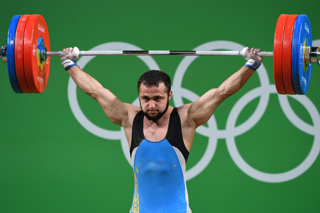 Kazakhstan's Nijat Rahimov smashed the clean and jerk world record to steal the men’s 77 kilograms Olympic weightlifting gold medal from the grasp of China’s Lyu Xiaojun ©Getty Images