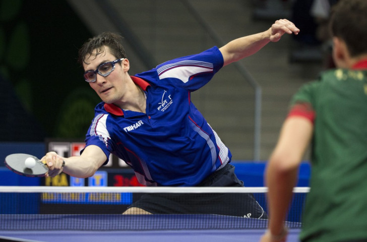 France's Adrien Mattenet returns a ball to Portugal's Tiago Apolonia during the men's table tennis team gold medal match ©Getty Images