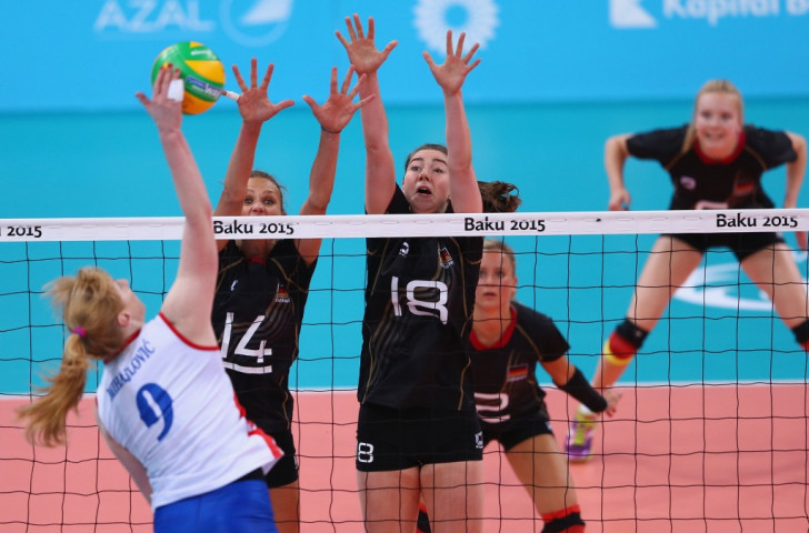 Margareta Kozuch and Wiebke Silge of Germany block a spike from Serbia's Brankica Mihajlovic during the women's volleyball preliminary Pool B match ©Getty Images