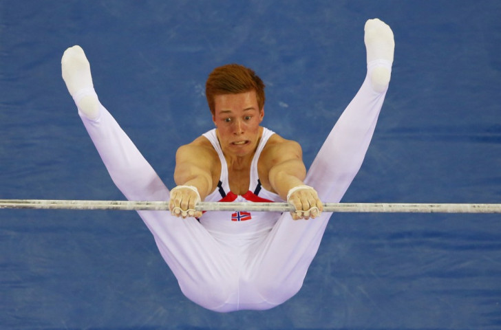Norway's Stian Skjerahaug competes on the high bar during the men's artistic gymnastics team and all-around qualification ©Getty Images