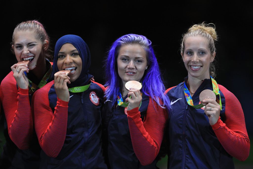 Ibtihaj Muhammad (second left) became the first American wearing a hijab to claim an Olympic medal ©Getty Images