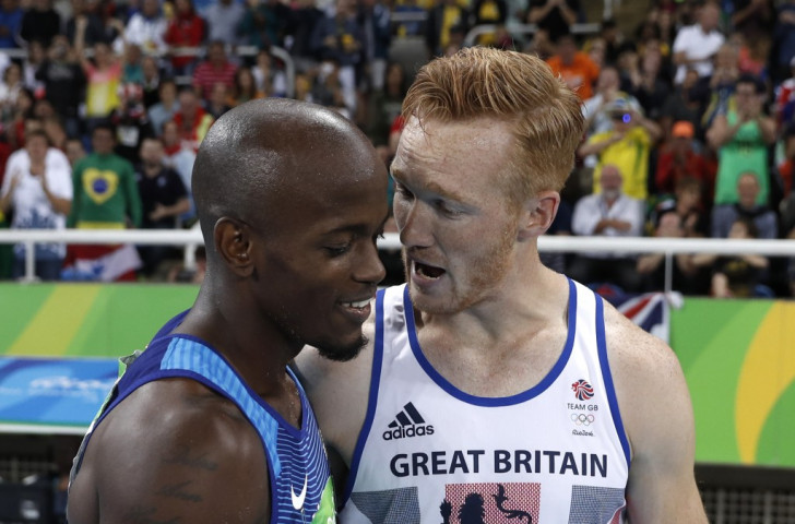Olympic champions present and past - London 2012 long jump champion Greg Rutherford, who took bronze here, congratulates Jeff Henderson of the United States who claimed the Rio 2016 title with his last attempt ©Getty Images