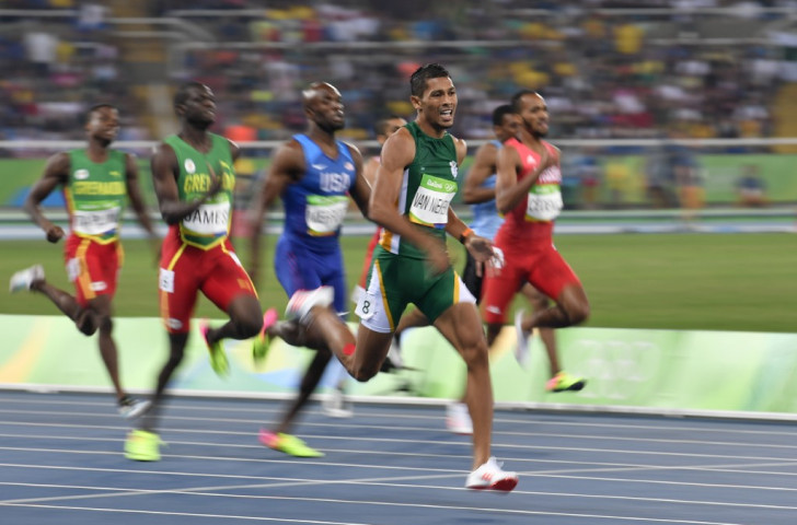 Wayde van Niekerk heads for an Olympic 400m gold medal and world record of 43.03 from the outside lane as defending champion Kirani James and LaShawn Merritt contest silver ©Getty Images

